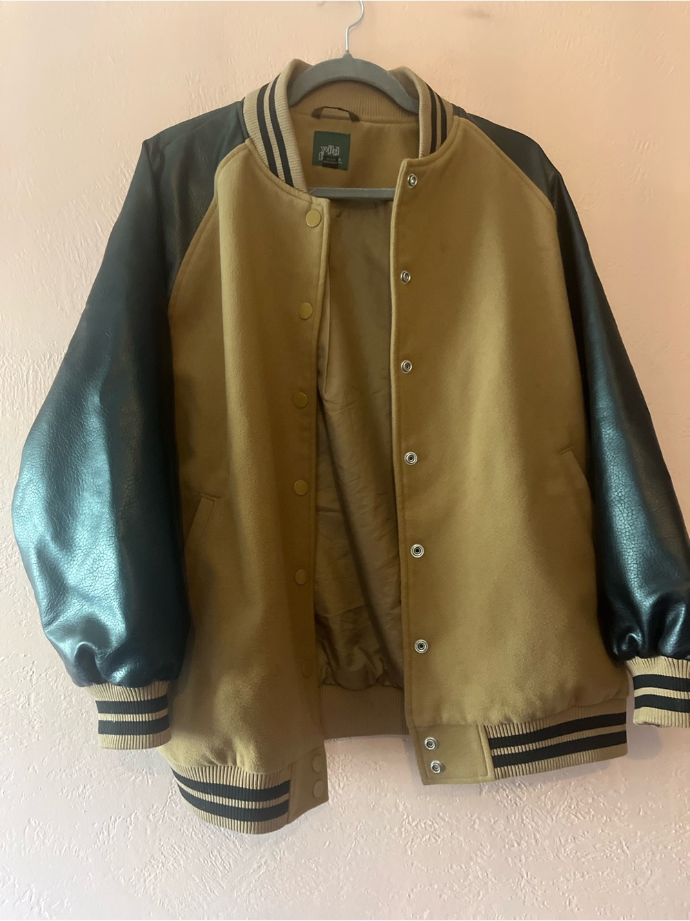 Wild Fable varsity jacket features a tan body and black sleeves